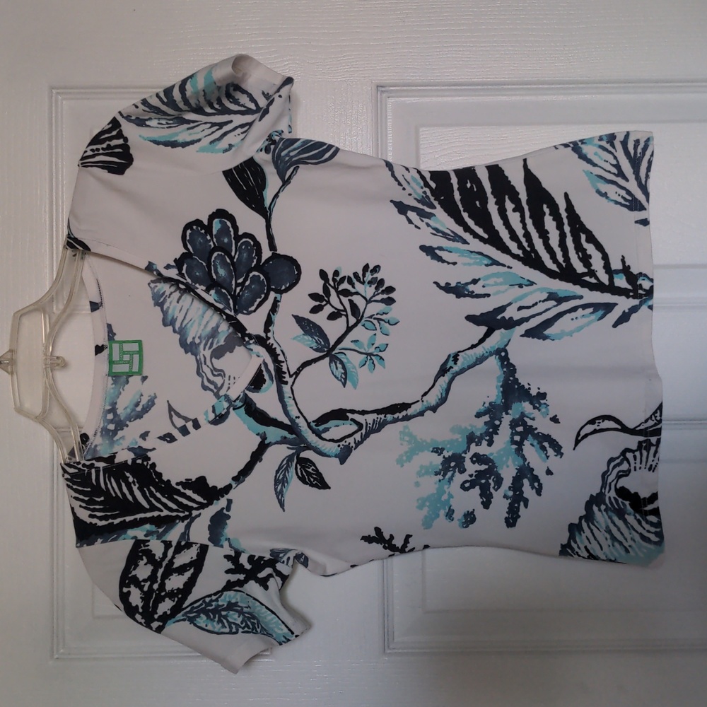This is a Manuel Canvos v-neck shirt size 10/12